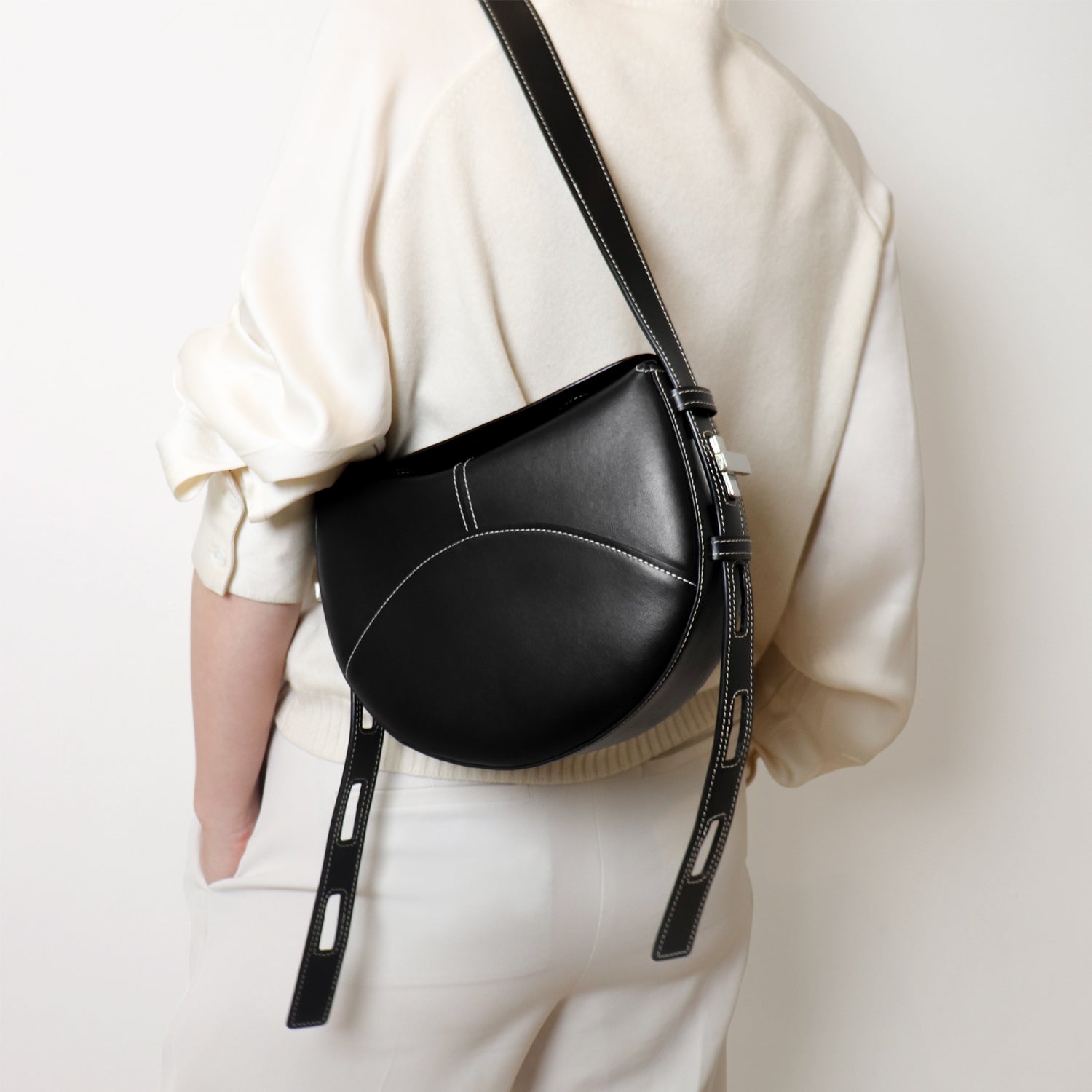 Shaker Twist Bag in black, worn by a model